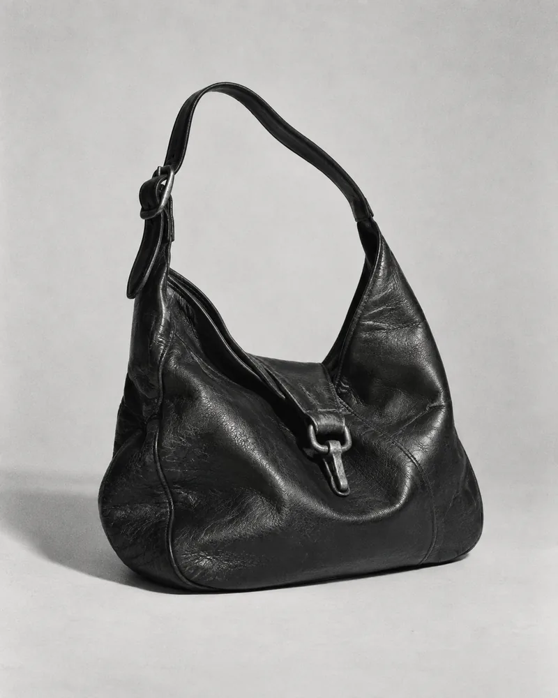Illustrative vintage black leather shoulder bag